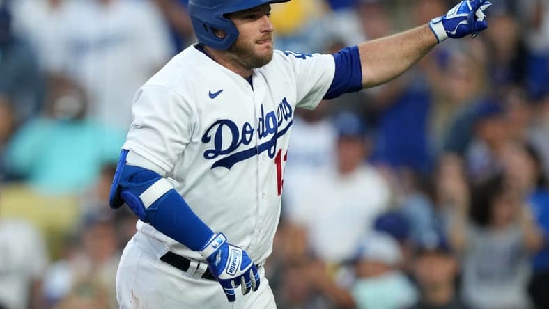 Jul 3, 2023; Los Angeles, California, USA; Los Angeles Dodgers third baseman Max Muncy (13) reacts after hitting a solo home run in the second inning against the Pittsburgh Pirates at Dodger Stadium. Mandatory Credit: Kirby Lee-USA TODAY Sports