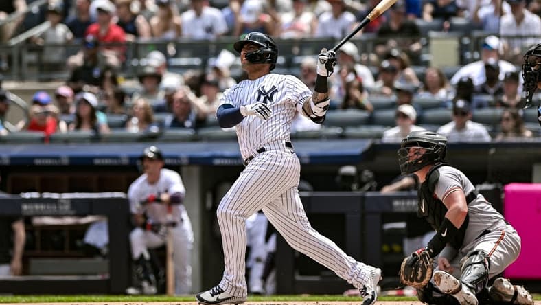 Jul 4, 2023; Bronx, New York, USA; New York Yankees second baseman Gleyber Torres (25) hits a two-run home run against the Baltimore Orioles during the first inning at Yankee Stadium. Mandatory Credit: John Jones-USA TODAY Sports