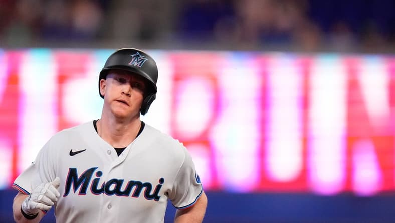 Jul 4, 2023; Miami, Florida, USA; Miami Marlins first baseman Garrett Cooper (26) runs the bases after hitting a home run against the St. Louis Cardinals during the third inning at loanDepot Park. Mandatory Credit: Rich Storry-USA TODAY Sports