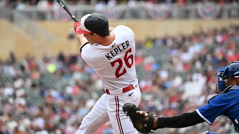 Jul 4, 2023; Minneapolis, Minnesota, USA; Minnesota Twins right fielder Max Kepler (26) hits a two-run home run off Kansas City Royals starting pitcher Zack Greinke (not pictured) during the third inning as catcher Salvador Perez (13) looks on at Target Field. Mandatory Credit: Jeffrey Becker-USA TODAY Sports