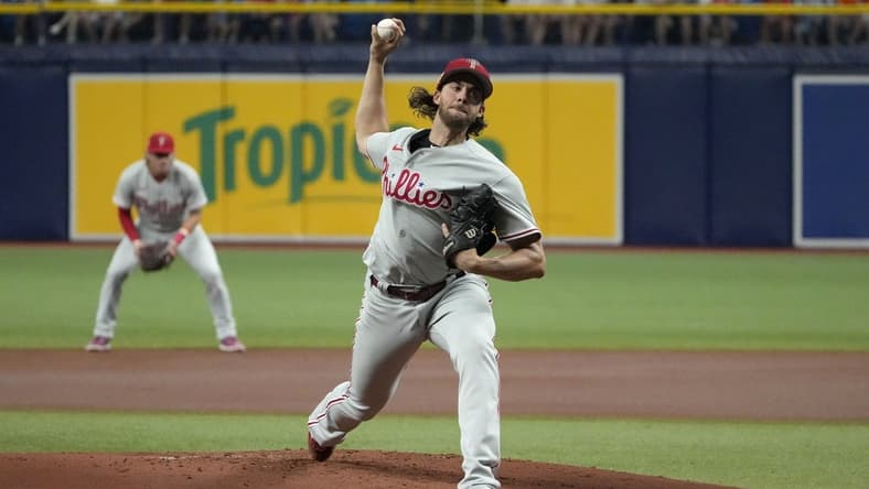 Jul 4, 2023; St. Petersburg, Florida, USA; Philadelphia Phillies starting pitcher Aaron Nola (27) throws a pitch against the Tampa Bay Rays during the first inning at Tropicana Field. Mandatory Credit: Dave Nelson-USA TODAY Sports
