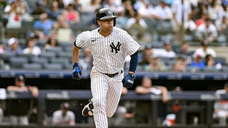 Jul 4, 2023; Bronx, New York, USA; New York Yankees center fielder Isiah Kiner-Falefa (12) runs to first base after hitting a double against the Baltimore Orioles during the eighth inning at Yankee Stadium. Mandatory Credit: John Jones-USA TODAY Sports