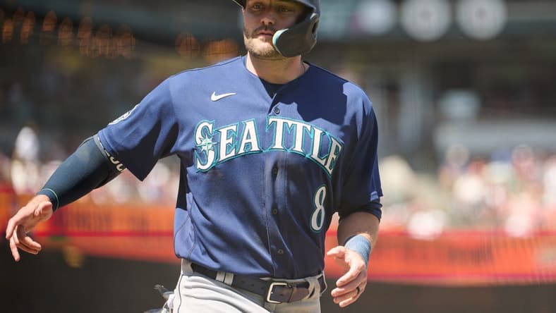 Jul 4, 2023; San Francisco, California, USA; Seattle Mariners designated hitter AJ Pollock (8) scores a run against the San Francisco Giants during the sixth inning at Oracle Park. Mandatory Credit: Robert Edwards-USA TODAY Sports