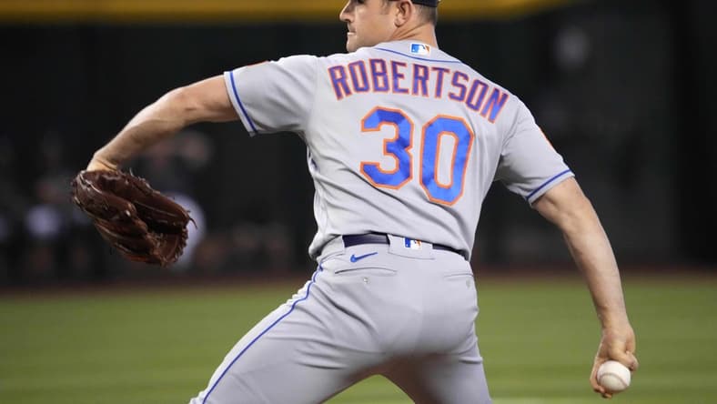 Jul 4, 2023; Phoenix, Arizona, USA; New York Mets relief pitcher David Robertson (30) pitches against the Arizona Diamondbacks during the ninth inning at Chase Field. Mandatory Credit: Joe Camporeale-USA TODAY Sports