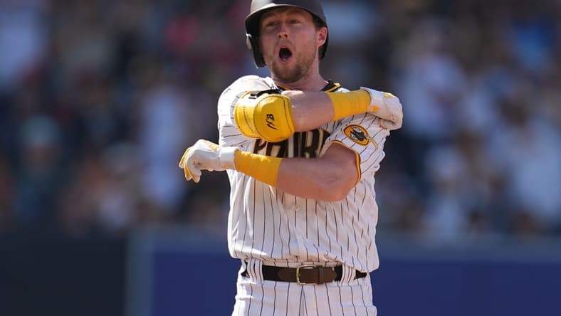 Jul 4, 2023; San Diego, California, USA; San Diego Padres first baseman Jake Cronenworth (9) reacts after hitting a double against the Los Angeles Angels during the fourth inning at Petco Park. Mandatory Credit: Ray Acevedo-USA TODAY Sports