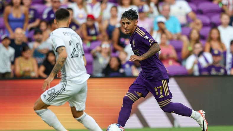 Jul 4, 2023; Orlando, Florida, USA; Orlando City SC forward Facundo Torres (17) controls the ball against Toronto FC in the first half at Exploria Stadium. Mandatory Credit: Nathan Ray Seebeck-USA TODAY Sports