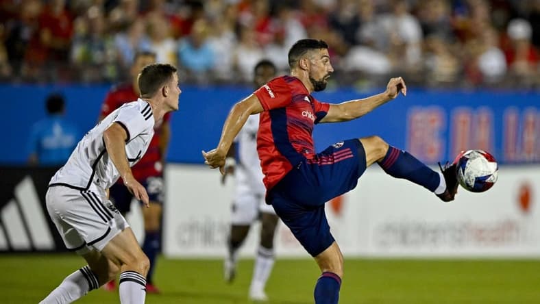 Jul 4, 2023; Frisco, Texas, USA; FC Dallas midfielder Sebastian Lletget (12) contols the ball in front of D.C. United forward Pedro Santos (7) during the second half at Toyota Stadium. Mandatory Credit: Jerome Miron-USA TODAY Sports
