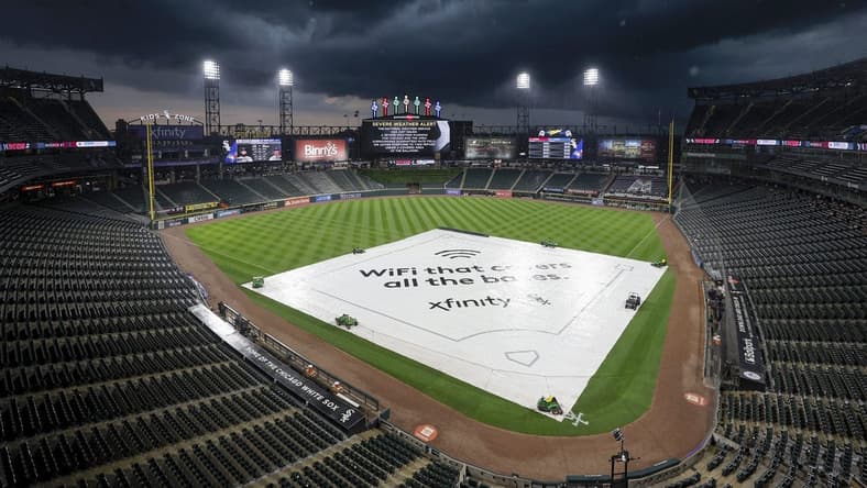 Jul 5, 2023; Chicago, Illinois, USA; A tarp covers the infield during a rain delay before a game between the Chicago White Sox and Toronto Blue Jays at Guaranteed Rate Field. Mandatory Credit: Kamil Krzaczynski-USA TODAY Sports