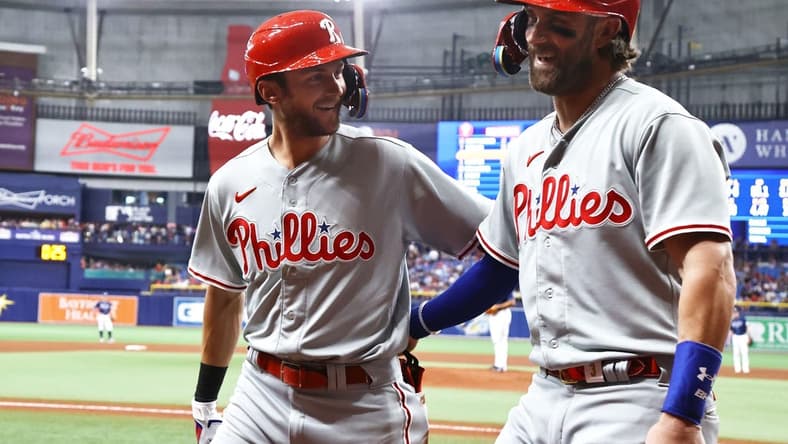 Jul 5, 2023; St. Petersburg, Florida, USA;  Philadelphia Phillies shortstop Trea Turner (7) is congratulated  by  designated hitter Bryce Harper (3) after scoring against the Tampa Bay Rays during the fifth inning at Tropicana Field. Mandatory Credit: Kim Klement-USA TODAY Sports