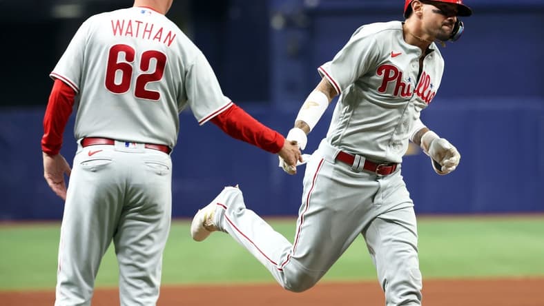 Jul 5, 2023; St. Petersburg, Florida, USA; Philadelphia Phillies right fielder Nick Castellanos (8) is congratulated by third base coach Dusty Wathan (62) after hitting a home run against the Tampa Bay Rays during the sixth inning at Tropicana Field. Mandatory Credit: Kim Klement-USA TODAY Sports