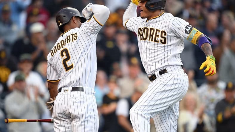 Jul 5, 2023; San Diego, California, USA; San Diego Padres third baseman Manny Machado (right) celebrates with  designated hitter Xander Bogaerts (2) after hitting a home run against the Los Angeles Angels during the sixth inning at Petco Park. Mandatory Credit: Orlando Ramirez-USA TODAY Sports