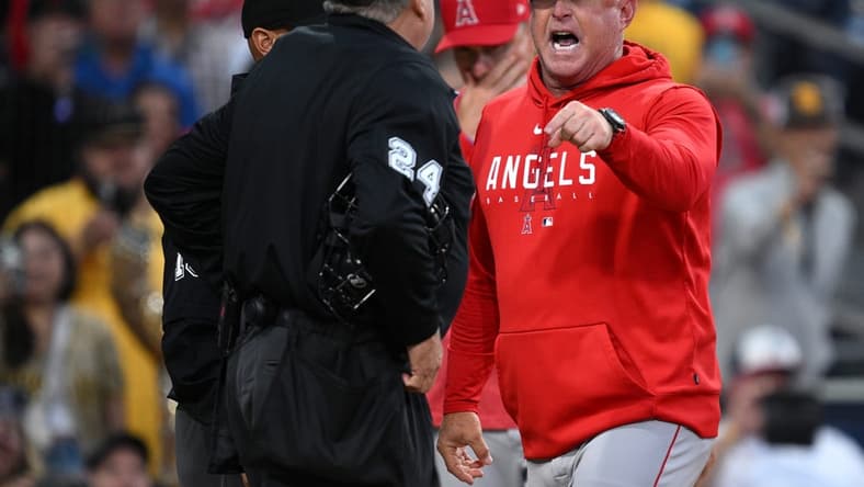 Jul 5, 2023; San Diego, California, USA; Los Angeles Angels manager Phil Nevin (right) argues with home plate umpire Jerry Layne (24) during the seventh inning at Petco Park. Mandatory Credit: Orlando Ramirez-USA TODAY Sports