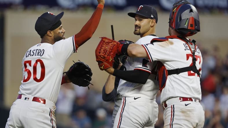 Jul 5, 2023; Minneapolis, Minnesota, USA; Minnesota Twins starting pitcher Pablo Lopez (49) celebrates his shutout win over the Kansas City Royals with catcher Ryan Jeffers (27) and center fielder Willi Castro (50) after the ninth inning at Target Field. Mandatory Credit: Bruce Kluckhohn-USA TODAY Sports