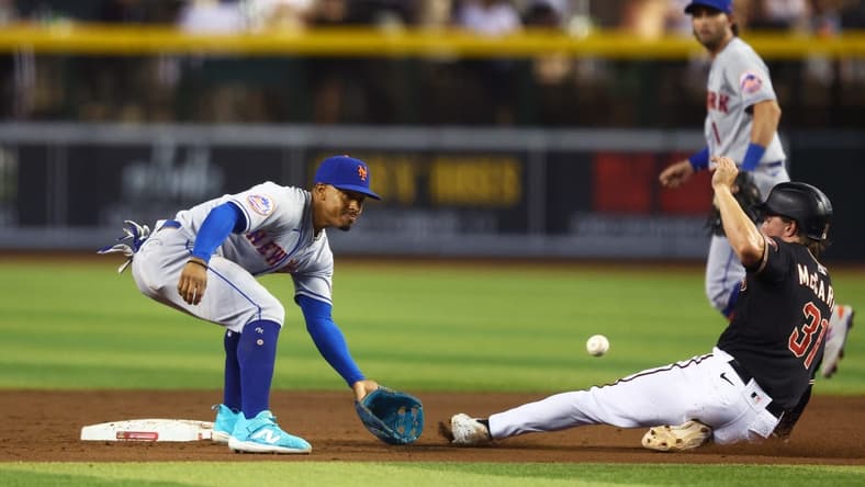 Jul 5, 2023; Phoenix, Arizona, USA; Arizona Diamondbacks base runner Jake McCarthy (right) steals second ahead of the tag from New York Mets shortstop Francisco Lindor in the fifth inning at Chase Field. Mandatory Credit: Mark J. Rebilas-USA TODAY Sports