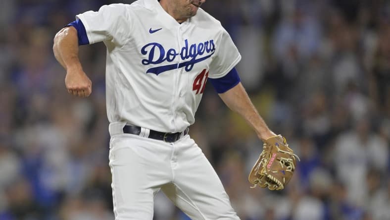 Jul 5, 2023; Los Angeles, California, USA; Los Angeles Dodgers relief pitcher Daniel Hudson (41) reacts after earning his first save of the season in the ninth inning against the Pittsburgh Pirates at Dodger Stadium. Mandatory Credit: Jayne Kamin-Oncea-USA TODAY Sports