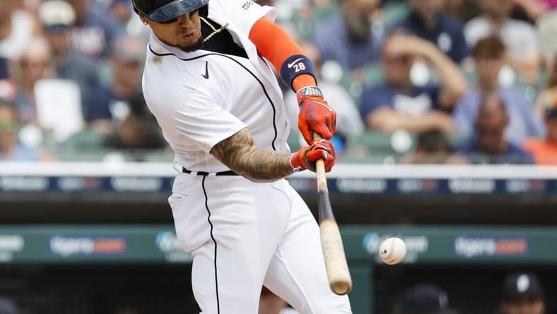 Jul 6, 2023; Detroit, Michigan, USA;  Detroit Tigers shortstop Javier Baez (28) hits a double in the fifth inning against the Oakland Athletics at Comerica Park. Mandatory Credit: Rick Osentoski-USA TODAY Sports