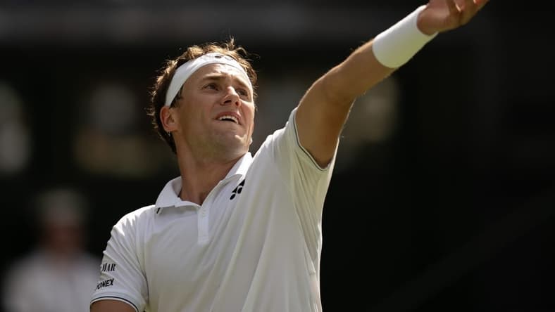 Jul 6, 2023; London, United Kingdom; Casper Ruud (NOR) tosses the ball to serve during his match against Liam Broady (GBR) on day four at the All England Lawn Tennis and Croquet Club.  Mandatory Credit: Susan Mullane-USA TODAY Sports