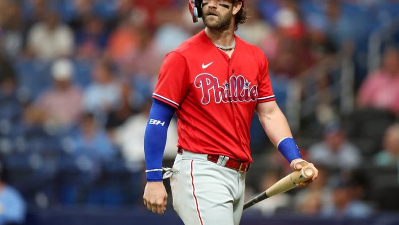 Jul 6, 2023; St. Petersburg, Florida, USA; Philadelphia Phillies designated hitter Bryce Harper (3) looks on after striking out against the Tampa Bay Rays in the first inning at Tropicana Field. Mandatory Credit: Nathan Ray Seebeck-USA TODAY Sports