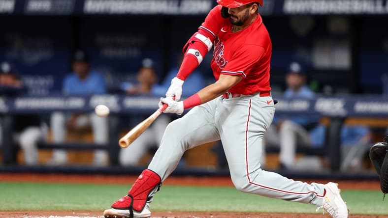 Jul 6, 2023; St. Petersburg, Florida, USA;  Philadelphia Phillies first baseman Darick Hall (24) hits a solo home runagainst the Tampa Bay Rays in the fifth inning at Tropicana Field. Mandatory Credit: Nathan Ray Seebeck-USA TODAY Sports