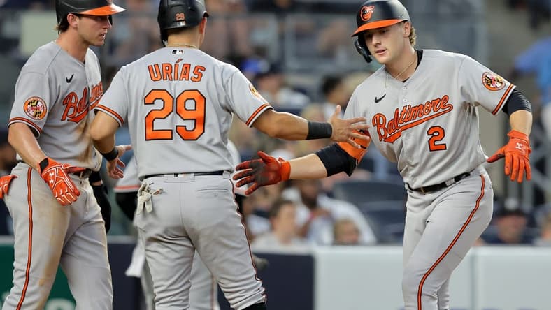 Jul 6, 2023; Bronx, New York, USA; Baltimore Orioles shortstop Gunnar Henderson (2) celebrates his three-run home against the New York Yankees with second baseman Jordan Westburg (11) and third baseman Ramon Urias (29) during the fourth inning at Yankee Stadium. Mandatory Credit: Brad Penner-USA TODAY Sports