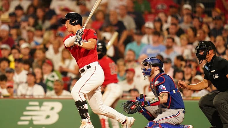Jul 6, 2023; Boston, Massachusetts, USA; Boston Red Sox left fielder Rob Refsnyder (30) hits a single to center field to drive in a run against the Texas Rangers in the sixth inning at Fenway Park. Mandatory Credit: David Butler II-USA TODAY Sports