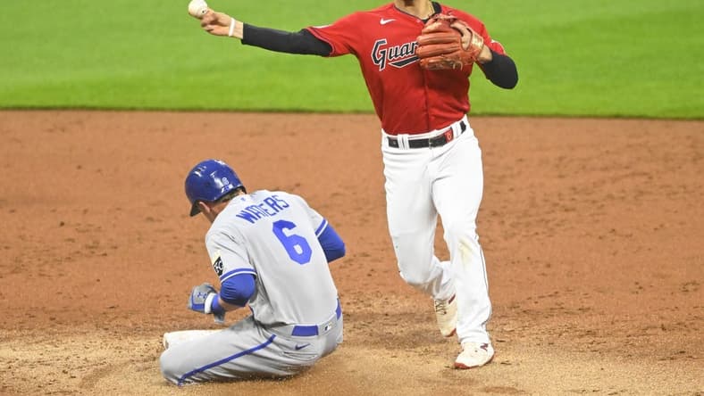 Jul 6, 2023; Cleveland, Ohio, USA; Cleveland Guardians second baseman Andres Gimenez (0) throws to second base against Kansas City Royals designated hitter Drew Waters (6) on a fielder s choice in the second inning at Progressive Field. Mandatory Credit: David Richard-USA TODAY Sports