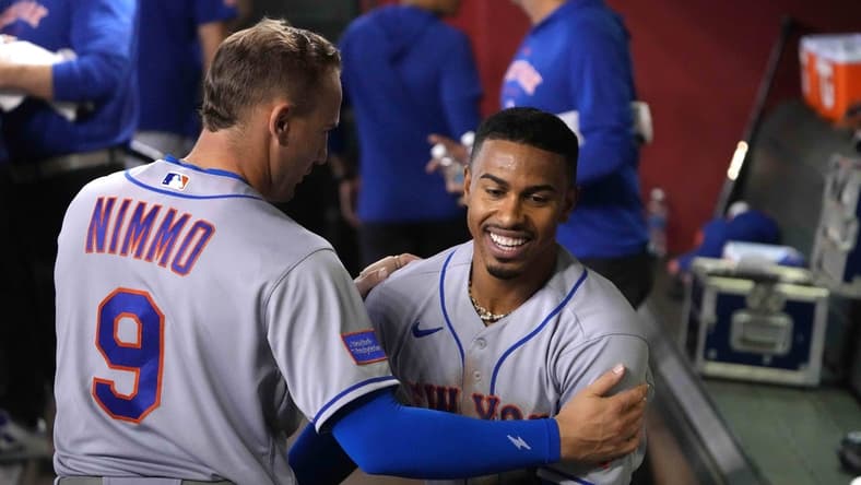 Jul 6, 2023; Phoenix, Arizona, USA; New York Mets shortstop Francisco Lindor (12) celebrates with New York Mets center fielder Brandon Nimmo (9) after scoring a run against the Arizona Diamondbacks during the third inning at Chase Field. Mandatory Credit: Joe Camporeale-USA TODAY Sports