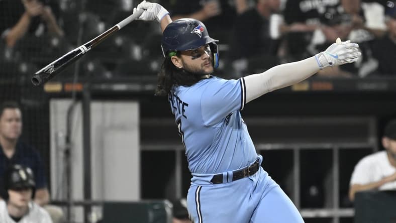 Jul 6, 2023; Chicago, Illinois, USA; Toronto Blue Jays shortstop Bo Bichette (11) hits a single against the Chicago White Sox during the seventh inning at Guaranteed Rate Field. Mandatory Credit: Matt Marton-USA TODAY Sports