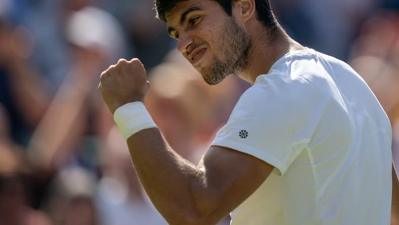 Jul 7, 2023; London, United Kingdom; Carlos Alcaraz (ESP) celebrates winning his match against Alexandre Muller (FRA) on day five of Wimbledon at the All England Lawn Tennis and Croquet Club. Mandatory Credit: Susan Mullane-USA TODAY Sports
