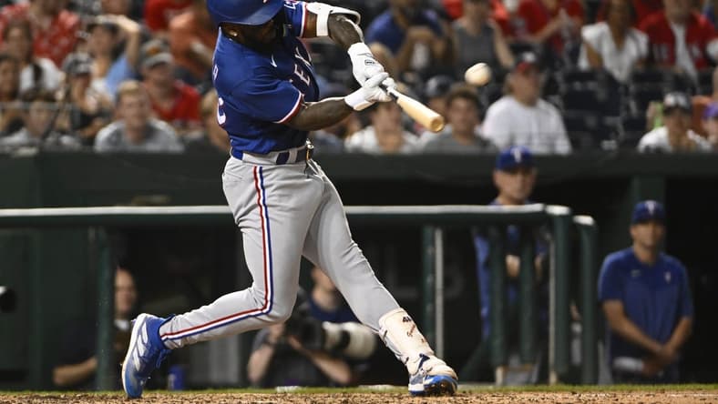 Jul 7, 2023; Washington, District of Columbia, USA; Texas Rangers right fielder Adolis Garcia (53) hits a solo home run against the Washington Nationals during the seventh inning at Nationals Park. Mandatory Credit: Brad Mills-USA TODAY Sports