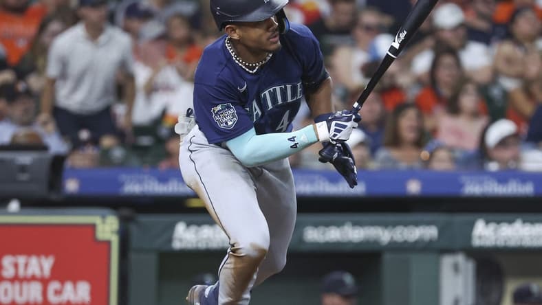 Jul 7, 2023; Houston, Texas, USA; Seattle Mariners center fielder Julio Rodriguez (44) drives in two runs with an RBI single during the fourth inning against the Houston Astros at Minute Maid Park. Mandatory Credit: Troy Taormina-USA TODAY Sports
