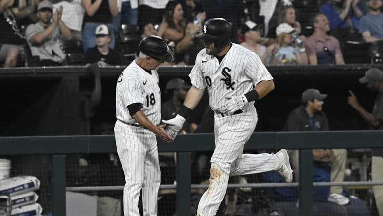 Jul 7, 2023; Chicago, Illinois, USA; Chicago White Sox third baseman Jake Burger (30) high fives Chicago White Sox third base coach Eddie Rodriguez (18) after he hits a home run against the St. Louis Cardinals during the fifth inning at Guaranteed Rate Field. Mandatory Credit: Matt Marton-USA TODAY Sports