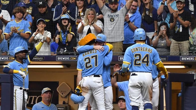 Jul 7, 2023; Milwaukee, Wisconsin, USA; Milwaukee Brewers designated hitter Jesse Winker (33) congratulates Milwaukee Brewers shortstop Willy Adames (27) after hitting a home run against the Cincinnati Reds in the fifth inning at American Family Field. Mandatory Credit: Michael McLoone-USA TODAY Sports