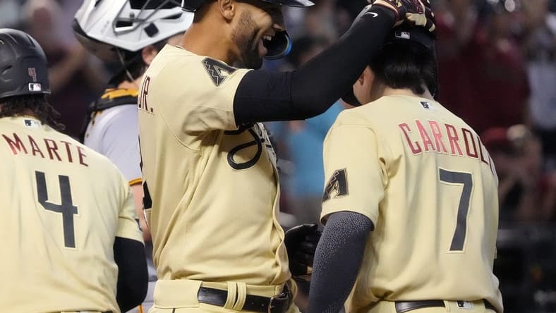 Jul 7, 2023; Phoenix, AZ, USA; Arizona Diamondbacks' Lourdes Gurriel Jr. (12) celebrates his 3-run home run with teammate Corbin Carroll (7) against the Pittsburgh Pirates at Chase Field.