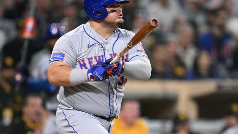 Jul 7, 2023; San Diego, California, USA; New York Mets designated hitter Daniel Vogelbach (32) hits an RBI single against the San Diego Padres during the fifth inning at Petco Park. Mandatory Credit: Orlando Ramirez-USA TODAY Sports