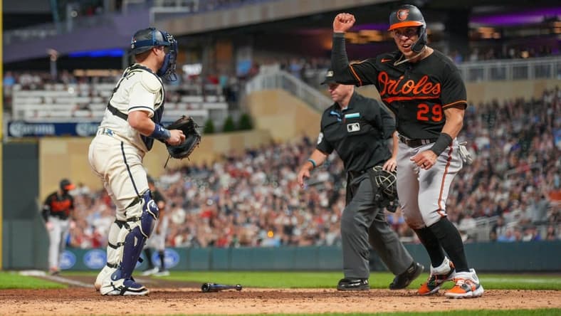 Jul 7, 2023; Minneapolis, Minnesota, USA; Baltimore Orioles third baseman Ramon Urias (29) celebrates scoring in the tenth inning against the Minnesota Twins at Target Field. Mandatory Credit: Matt Blewett-USA TODAY Sports