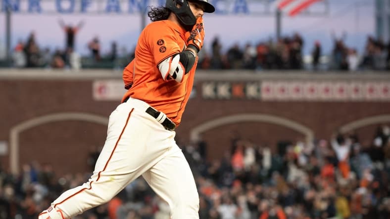 Jul 7, 2023; San Francisco, California, USA; San Francisco Giants shortstop Brandon Crawford (35) blows a kiss to his team mates in the dugout after hitting a home run during the sixth inning against the Colorado Rockies at Oracle Park. Mandatory Credit: Ed Szczepanski-USA TODAY Sports