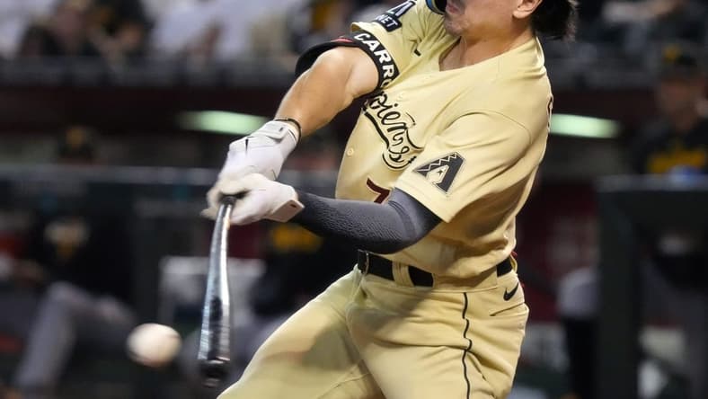 July 7, 2023; Phoenix, AZ, USA; Arizona Diamondbacks' Corbin Carroll (7) hits a single against the Pittsburgh Pirates at Chase Field.