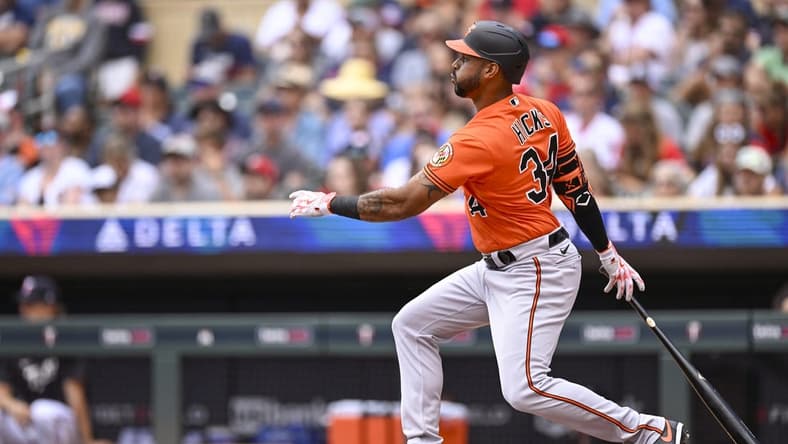 Jul 8, 2023; Minneapolis, Minnesota, USA; Baltimore Orioles outfielder Aaron Hicks (34) hits a single against the Minnesota Twins during the second inning at Target Field. Mandatory Credit: Nick Wosika-USA TODAY Sports