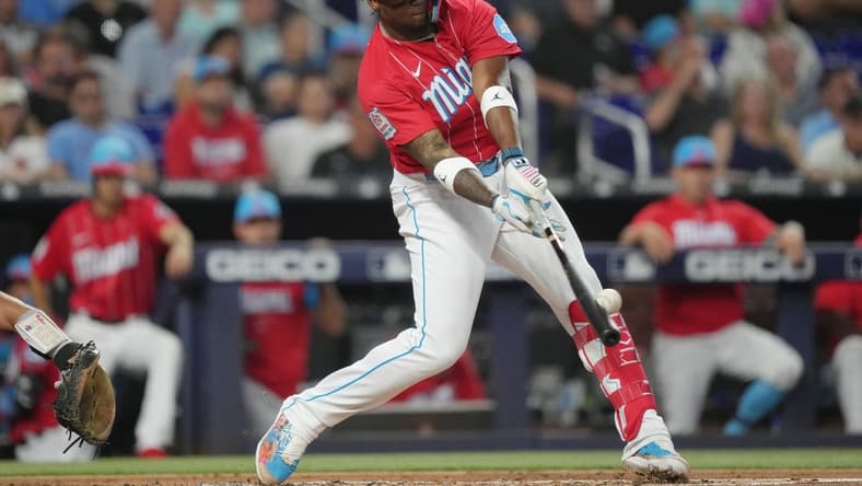 Jul 8, 2023; Miami, Florida, USA; Miami Marlins right fielder Jorge Soler (12) hits a home run against the Philadelphia Phillies in the first inning at loanDepot Park. Mandatory Credit: Jim Rassol-USA TODAY Sports