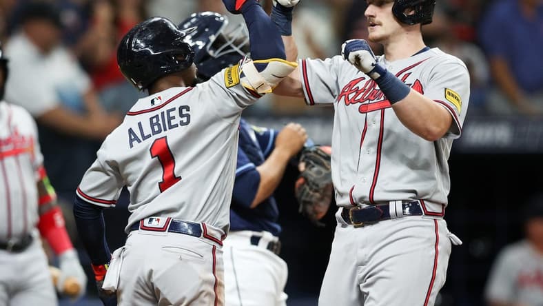 Jul 8, 2023; St. Petersburg, Florida, USA; Atlanta Braves catcher Sean Murphy (12) celebrates with second baseman Ozzie Albies (1) after hitting a three run home run against the Tampa Bay Rays in the fourth inning at Tropicana Field. Mandatory Credit: Nathan Ray Seebeck-USA TODAY Sports