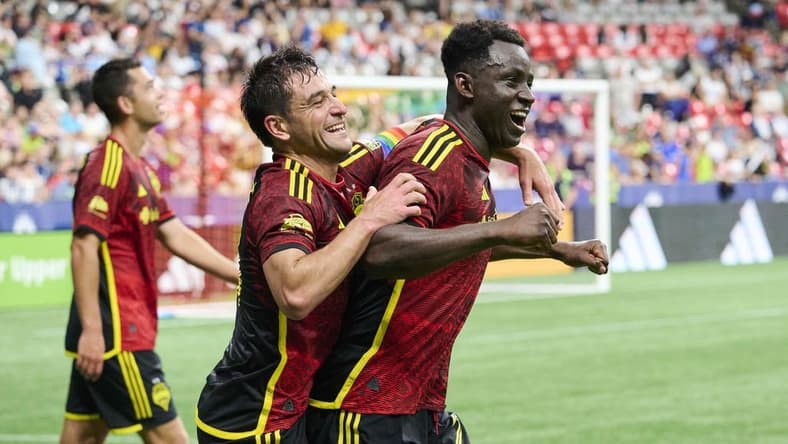 Jul 8, 2023; Vancouver, British Columbia, CAN; Seattle Sounders defender Yeimar Gomez (28) celebrates with midfielder Nicolas Lodeiro (10) after scoring the game winning goal during the second half against the Vancouver Whitecaps at BC Place. Mandatory Credit: Troy Wayrynen-USA TODAY Sports