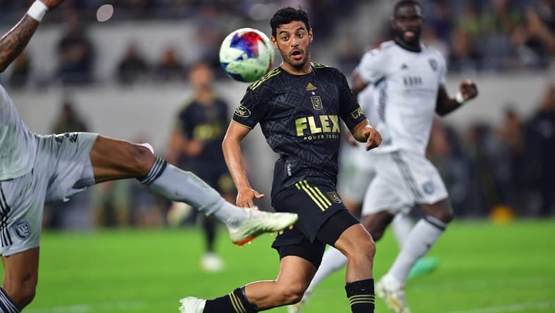 July 8, 2023; Los Angeles, California, USA; Los Angeles FC forward Carlos Vela (10) plays for the ball against San Jose Earthquakes defender Rodrigues (26) during the second half at BMO Stadium. Mandatory Credit: Gary A. Vasquez-USA TODAY Sports