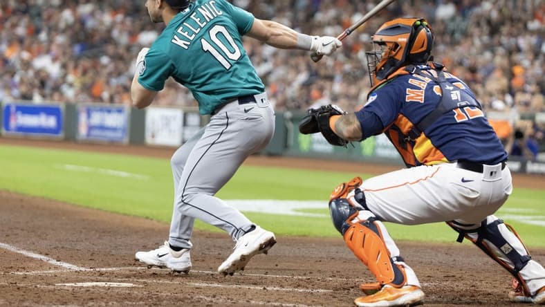 Jul 9, 2023; Houston, Texas, USA; Seattle Mariners left fielder Jarred Kelenic (10) hits a RBI double against the Houston Astros in the fourth inning at Minute Maid Park. Mandatory Credit: Thomas Shea-USA TODAY Sports
