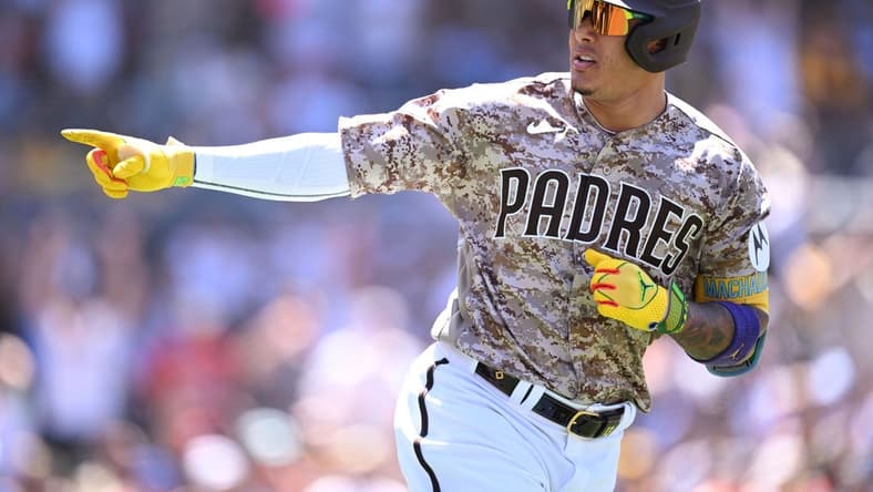 Jul 9, 2023; San Diego, California, USA; San Diego Padres third baseman Manny Machado (13) gestures toward the Padres dugout after hitting a two-run home run against the New York Mets during the fifth inning at Petco Park. Mandatory Credit: Orlando Ramirez-USA TODAY Sports