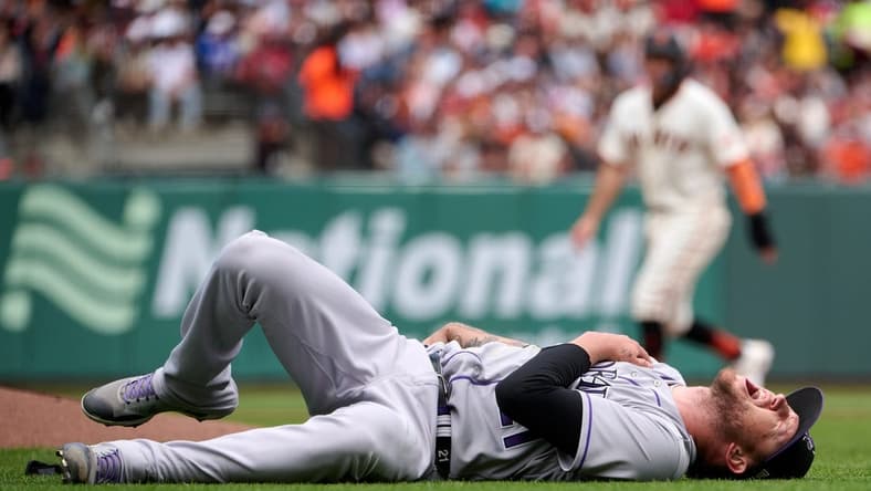 Jul 9, 2023; San Francisco, California, USA; Colorado Rockies pitcher Kyle Freeland (21) lies on field after injuring his right shoulder against the San Francisco Giants during the seventh inning at Oracle Park. Mandatory Credit: Robert Edwards-USA TODAY Sports