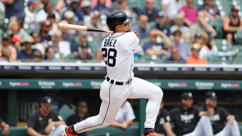 Jul 6, 2023; Detroit, Michigan, USA; Detroit Tigers shortstop Javier Baez (28) hits a double in the fifth inning against the Oakland Athletics at Comerica Park. Mandatory Credit: Rick Osentoski-USA TODAY Sports