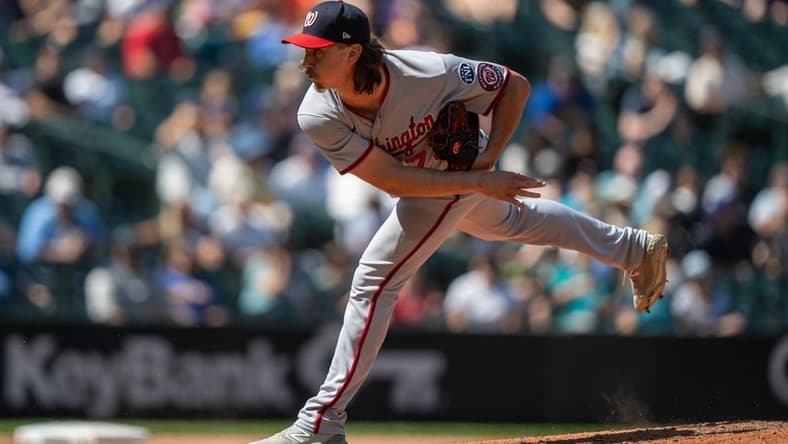 Jun 28, 2023; Seattle, Washington, USA; Washington Nationals reliever Hunter Harvey (73) delivers a pitch against the Seattle Mariners at T-Mobile Park. Mandatory Credit: Stephen Brashear-USA TODAY Sports