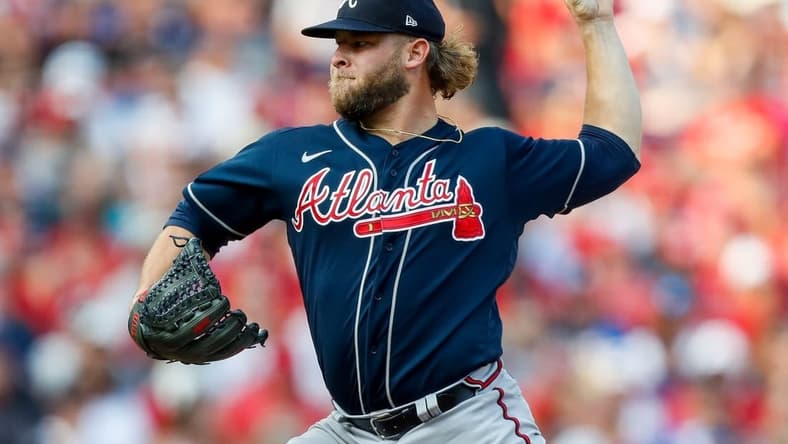 Jun 24, 2023; Cincinnati, Ohio, USA; Atlanta Braves relief pitcher A.J. Minter (33) pitches against the Cincinnati Reds in the eighth inning at Great American Ball Park. Mandatory Credit: Katie Stratman-USA TODAY Sports