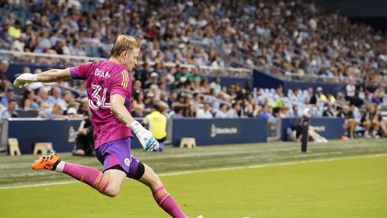 Jun 24, 2023; Kansas City, Kansas, USA; Chicago Fire goalkeeper Chris Brady (34) puts the ball in play against Sporting Kansas City during the match at Children's Mercy Park. Mandatory Credit: Denny Medley-USA TODAY Sports